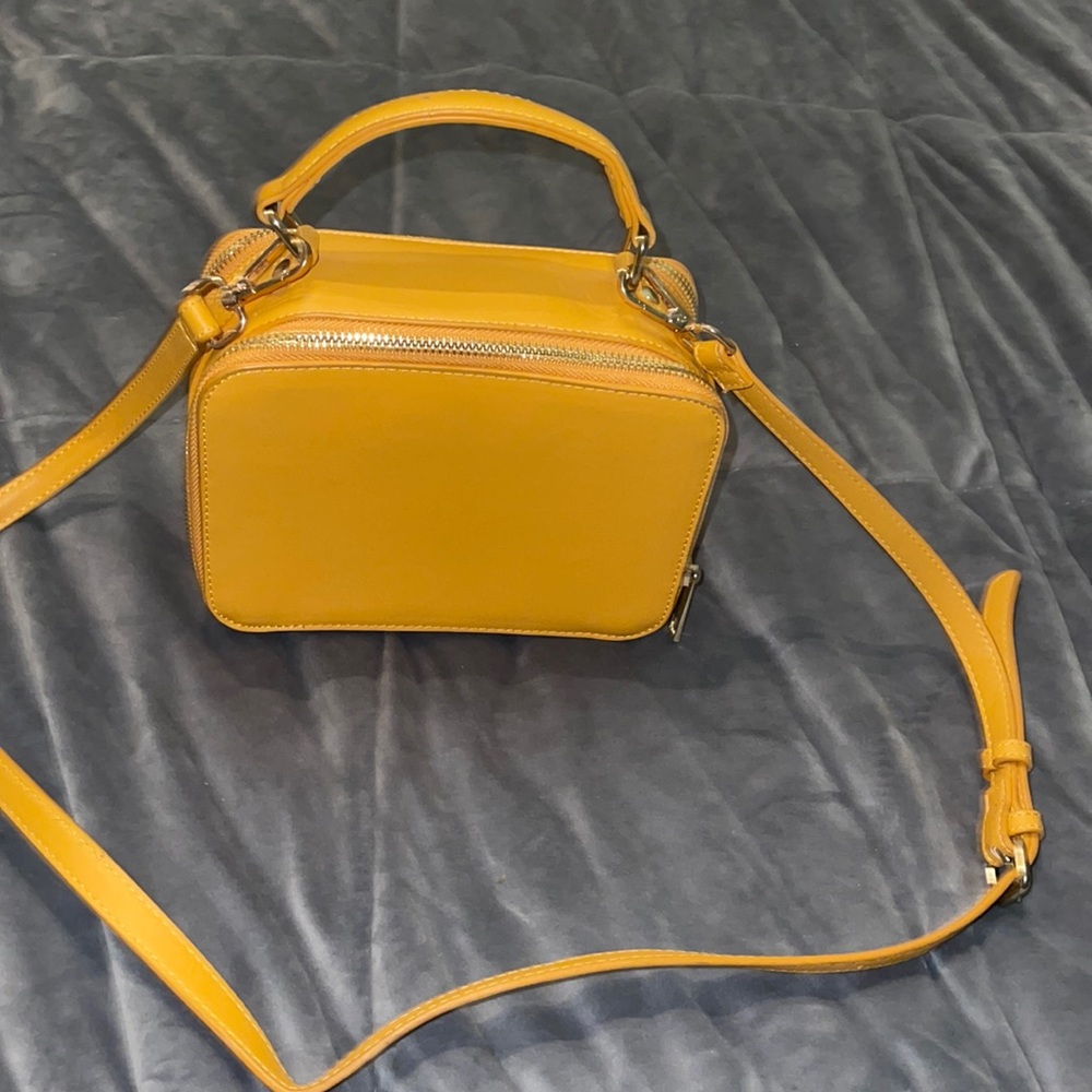 Mustard colored pocket book